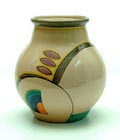 Aardewerk vaas model no.28 met decoratie in geel paars oranje en groen tussen gele biezen op een crème ondergrond geschilderd door J.G.van Vliet L.H.de Vrind uitvoering Potterie Kennemerland / Velsen ca.1930 