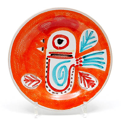 Earthenware plate with coloured decoration in orange red green brown design executed by Desimone / Italy ca.1960 