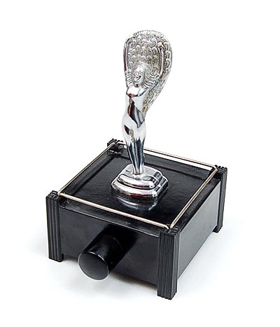Bakelite Silent Flame table lighter with chromium plated sculpture of Fan Dancer Sally Rand and electrical lightning executed by Parker of Londen USA ca.1940 