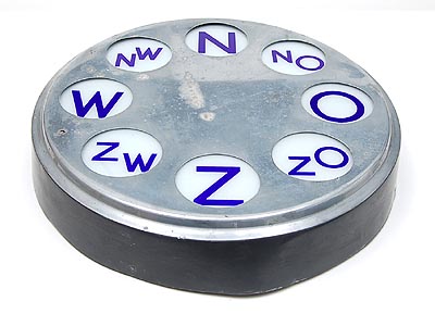 Nickle plated metal electric wind-vane with white glas dial on which blue letters design 1935 executed by Gispen / the Netherlands 1942 