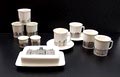 Delen van het Nutricia Grachten servies gedecoreerd met afbeeldingen van H.E.Roodenburg uitvoering Villeroy Boch 1964 
