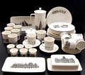 Delen van het Nutricia Grachten servies gedecoreerd met afbeeldingen van H.E.Roodenburg uitvoering Villeroy Boch 1964 Koffiepot Suikerpot met deksel Melkkannetje Bekers 6x Kop schotels 6x Ontbijtborden 6x Diepe borden 4x Eierdoppen 6x Botervloot Serveerschaaltjes 2x 