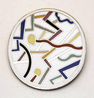 Metal brooch with enamel decoration Circulus design Ettore Sottsass 1985 executed by Acme / USA Part of the permanent collection of the Brooklyn Museum / New York 