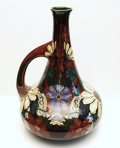 Polychrome earthenware vase with one handle no.1035 decor A executed by Firma Wed Brantjes en Co Purmerend / the Netherlands 1895/1904 