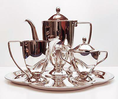 Silver plated hotel quality coffeeservice with original tray executed by Hollandia Plate Hilversum / the Netherlands ca.1930 Sizes Tray long 35 cm wide 30 cm Creamer height 12,5 cm Sugarbasin height 12,5 cm Coffeepot height 24 cm 