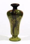 Polychrome earthenware vase with floral decoration executed by de Distel / Amsterdam / the Netherlands ca.1920 