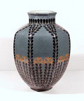 Vase model 269 eight-sided painted with stylized flowers and leaves in black and ochre on blue underground design Bert Nienhuis ca.1905 executed by de Distel Amsterdam / the Netherlands 