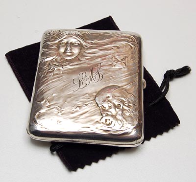  Silver Art-Nouveau cigarette-case with relief decoration of young girl / old man hour-glass design executed by R Blackington Co Massachusetts / USA 1920-'30 