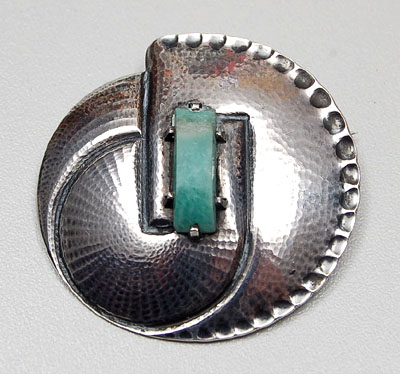  Silver hammered brooch with rectangular cut green gem design executed by A.Meyer Schoonhoven / the Netherlands ca.1930 