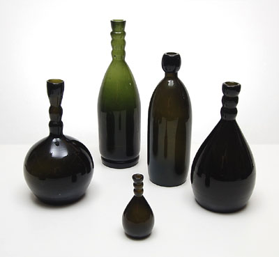  Set of 5 bottles design Jac.Jongert 1920 for Paq.Port of de firma Wed.G.Oud Pzn en Co Purmerend executed by N.V.United Glassworks Schiedam / the Netherlands Height's 29,6 / 24,8 / 22 / 21,7 / 10,3 cm 