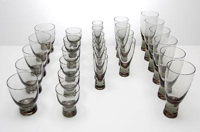  Beaker-glass service 27 pieces design Per Lütken 1953 executed by Holmegaard / Denmark Height's 6x 15,8 cm 4x 13,5 cm 6x 11,6 cm 5x 10,7 cm 6x 9 cm 