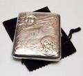  Silver Art-Nouveau cigarette-case with relief decoration of young girl / old man hour-glass design executed by R Blackington Co Massachusetts / USA 1920-'30 