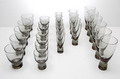  Beaker-glass service 27 pieces design Per Lütken 1953 executed by Holmegaard / Denmark Height's 6x 15,8 cm 4x 13,5 cm 6x 11,6 cm 5x 10,7 cm 6x 9 cm 