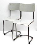  Buisstoelen 2x met houten zitting en rugleuning ontwerp uitvoering W.H.Gispen ca.1930 