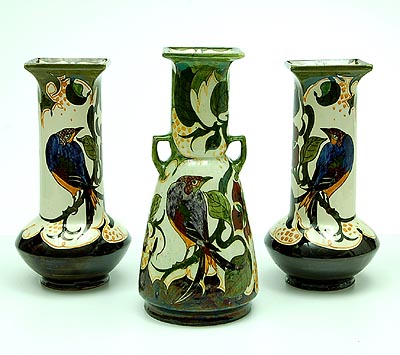 Polychrome glazed set of three earthenware vases decorated with birds and branches design Roelof Sterken executed by Nieuw Rozenburg Loosduinen den Haag / the Netherlands 1919-'23 