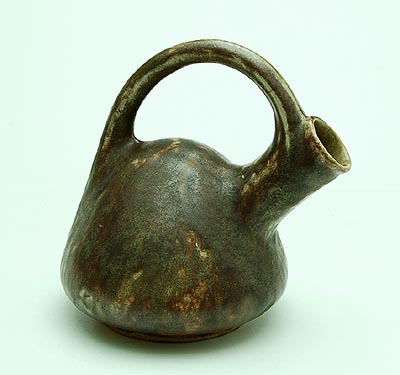 Brown glazed slipcast grès jug design execution by Roger Guérin Bouffioulx / Belgium ca.1915 