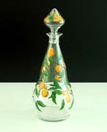 Wijnkaraf grootste maat van servies Smeerwortel met emailleverf decoratie van bladertakken en sinaasappelen ontwerp A.D.Copier 1923 uitvoering Glasfabriek Leerdam 