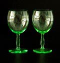 Two green white wine glasses of the service  F  design  K.P.C.de Bazel  1921-'23 executed by  Glasfabriek Leerdam  / the Netherlands 