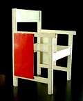 White lackered wooden childrens chair with red lackered side panels design attributed to Ko Verzuu / ADO / the Netherlands ca.1935 