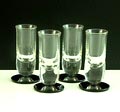 Likeurglaasjes 4x helder glas met zwartglazen aangezette voet ontwerp A.D.Copier 1932 uitvoering Glasfabriek Leerdam 