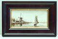 Sepia tegeltableau met voorstelling van molen aan water en boot in zwarte lijst met gouden bies uitvoering Zuid-Holland / Gouda ca.1910 