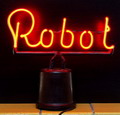 Rode neon-reclame met text Robot op bakelieten voet ca.1950 