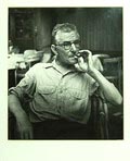Silver print Gerard den Brabander in atelier 1948/1949 fotograaf Emmy Andriesse 1914 - 1953 druk uit 1975 door Wies Meesters foto is onderdeel van een serie portretten van kunstenaars in hun atelier gemaakt in opdracht van het Stedelijk Museum Amsterdam 1948 - 1949 deze druk is gemaakt in opdracht van Galerie Fiolet t.b.v een tentoonstelling in het van Gogh Museum / Amsterdam in 1975 