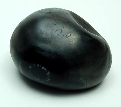  Zwart glazen object in de vorm van steen met helder glazen lens ontwerp Alfredo Barbini ca.1975 uitvoering Barbini Murano / Italie 