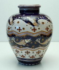  Aardewerk vaas met decoratie van zeemeerminnen en vissen in kobalt blauw en oker glazuur ontwerp H.Veldhuis uitvoering Haga / Purmerend 1904-1907 