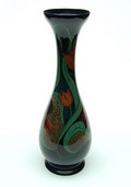  Hoge aardewerk vaas met polychrome florale decoratie geschilderd door J.H.W.Hartgring uitvoering Plateelbakkerij Zuid-Holland ca.1922 
