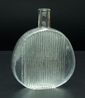  Decanter bottle with reliefdecoration at two sides executed by Nuutajärvi Notsjö / Finland ca.1970 