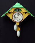  Lackered wood Cuckoo Clock design Robert Venturi 1986 executed by Alessi / Italy Has never been used still in original box Also the original protection wire for the chains is there 