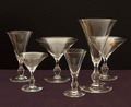  7 glazen van het servies Folium ontwerp Floris Meydam 1948 uitvoering Leerdam / Holland Maten Champagne flûte 1x 19 cm Champagne coupe 2x 12,7 cm Wijnglas 1x 14,8 cm Bitterglas 2x 11,6 cm Likeur coupe 1x 9,5 cm 