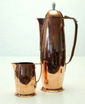 Copper hammered mocha-jug with matching milk-jug design attributed to Jan Eisenloeffel executed by Amstelhoek 1900-1903 the Netherlands 