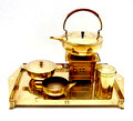  Geelkoperen theeset rechthoekig blad theepot op comfoor met brander suikerpot melkkannetje en theebus ontwerp in de stijl van Jan Eisenloeffel waarschijnlijk Duitsland ca.1910 
