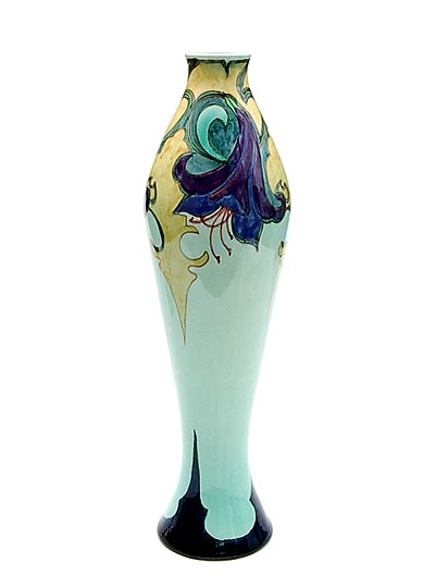 Earthenware vase with shiny glaze soft-green base with polychrome painted floral decoration painted by Johan Hartgring executed by Plateelbakkerij Zuid-Holland / the Netherlands 1900-'05 
