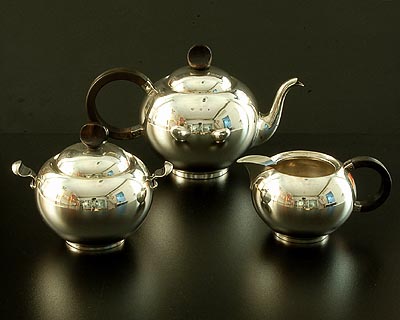 Silver tea-service teapot milkjug and sugarbasin all with wooden knobs and handles design attributed to Christa Ehrlich executed by Zilverfabriek Voorschoten the Netherlands 1939 