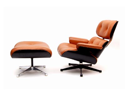  Eames Lounge Chair Model no.670 and Ottoman Model no.671 black lackered plywood seat shells with leather covered cushions on casted aluminium frames design Charles Ray Eames 1956 executed by Herman Miller / USA 