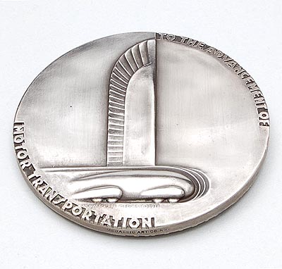 An American Art-Deco medal depicting the idea of streamlining during the period that speed captivated the nation design Norman Bel Geddes 1893-1958 scupltured by Rene Chambellan mint by Medallic Art Company USA for the 25th Anniversary of General Motors 1908-'33 with text To the advancement of motor transportation Commemorating the twenty-fifth anniversary of General Motors Annex an issue of the Automotive Daily News The Trade Newspaper Of The Industry vol 16 - No.2043 Detroit November 29 1933 - Section No 1 - 16 Pages with on the cover the medal seen on both sides 