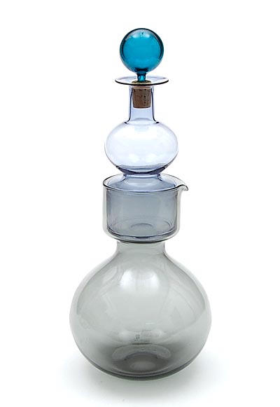 Glass carafe Kremlin Bells in two parts with glass stopper fitted in cork glass of lower part is fumi- of top lightpurple- and of stopper greencoloured design Kaj Franck 1955 executed by Nuutajärvi Notsjö / Finland 1965 