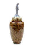 Earthenware Unica covered vase with green and brown streaming glaze on four rectangular feet and with a light-blue glazed serene female figure on top design executed by Pieter Groeneveldt Voorschoten / the Netherlands ca.1950 
