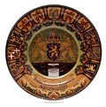 Earthenware wall-plate with double domed rim commissioned by de Koninklijke Veereniging van Nederlandsche Scherpschutters executed by Rozenburg The Hague / the Netherlands 1899 Executed in browns greens and ochres with written text Je Maintiendrai Koninklijke Vereeniging van Nederlandsche Scherpschutters Holland 17/26 Juni 1899 