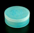 Glass covered box boîte ronde à crème D'Orsay with blue patine with relief decoration of nudes on cover design René Lalique ca.1912 executed by Lalique / France in original box 
