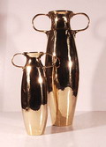 Twee messing oorvazen ontwerp J.C.Stoffels uitvoering Onder den Sint Maarten ca.1905 Hoog 34,5 22,5 cm 