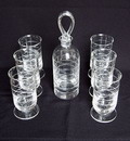 Blankglazen whiskyset bestaande uit een karaf en 6 bekerglazen op voet allen met horizontale schnitten Ontwerp A.D.Copier Leerdam / Holland 1937 Lit Leerdam catalogus 1937 