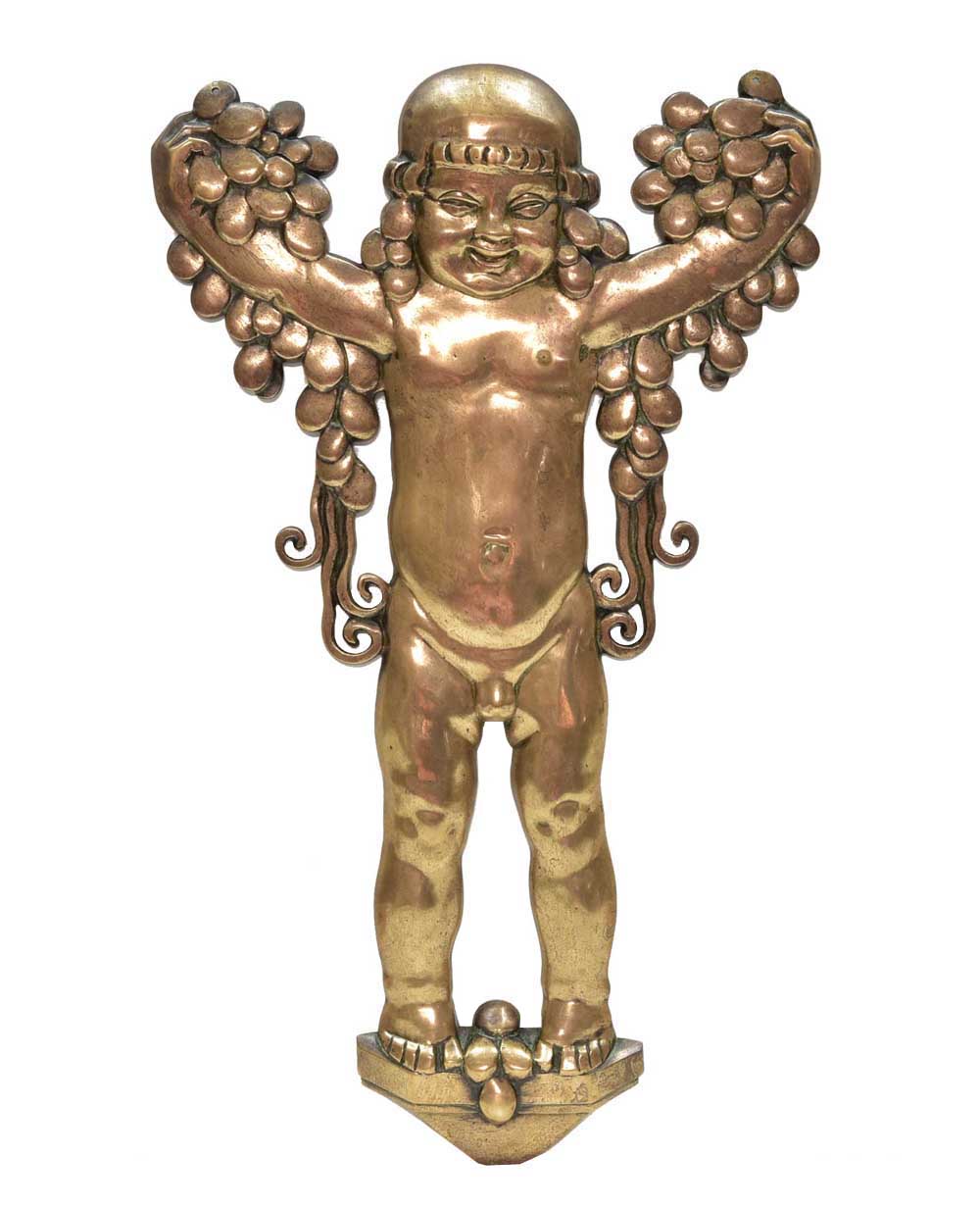 Bronze wall-applique of putto with grapes, in the style of Michael Powolny...